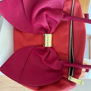 Betsy Johnson bag. New, never used but damaged handles due to being in a closet.